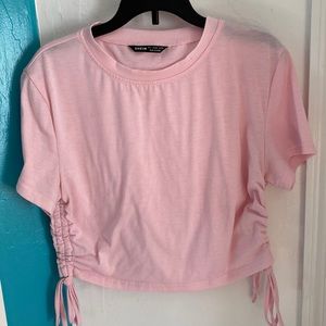 Pink crop top with adjustable ties on the side